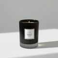 Ribbed black glass scented candle