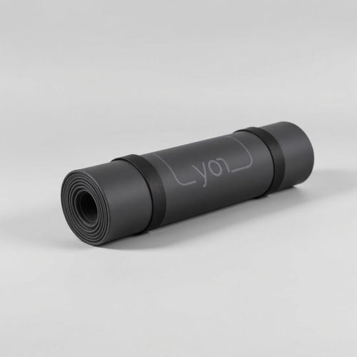 Rolled charcoal yoga mat with strap
